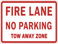 Fire Lane No Parking Tow Away Zone corrugated sign — red text on white background